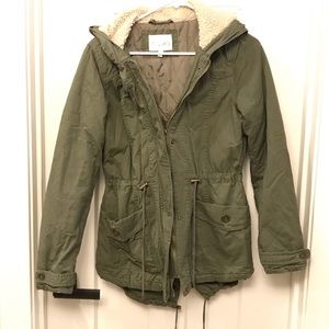 Delia’s olive jacket